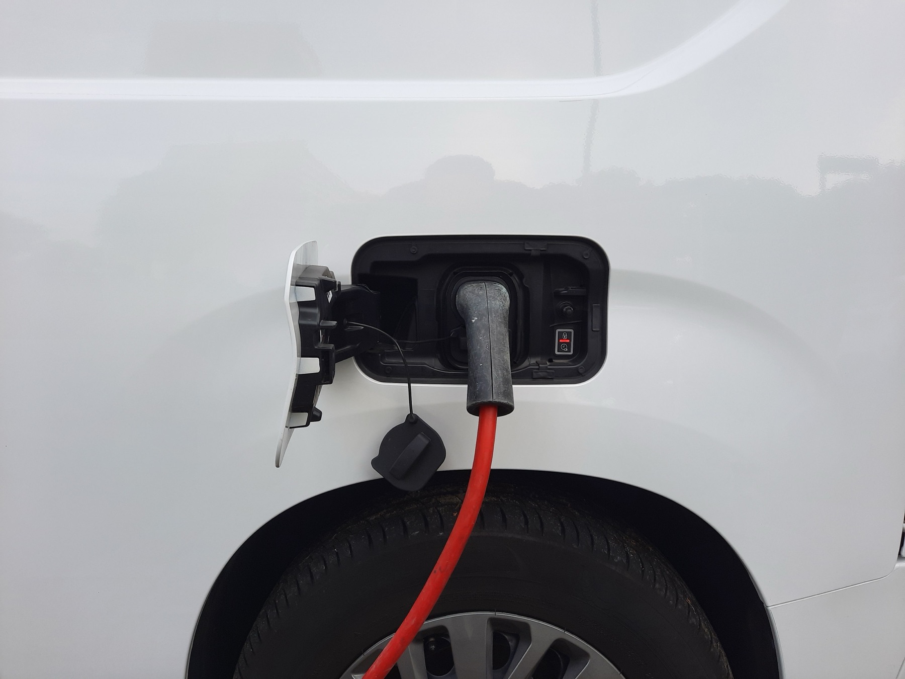 Electric vehicle connected to a charging cable